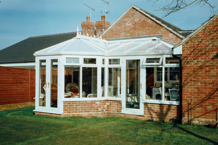 White PVCu P shape Combination Conservatory with 35mm Heat guard polycarbonate roof sheets   & French doors