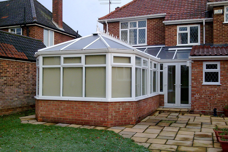 White PVCu P Shape Combination Conservatory with 25mm Opal roof sheets & French doors