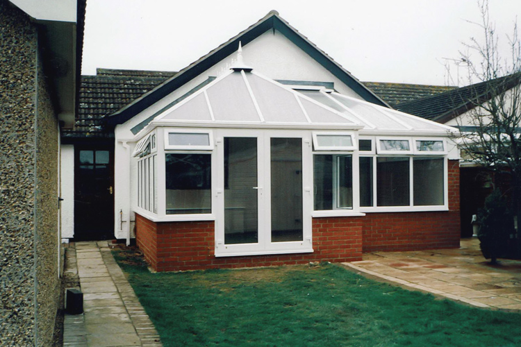 White PVCu Edwardian Combination Dwarf wall Conservatory with 25mm Opal polycarbonate roof sheets & French doors