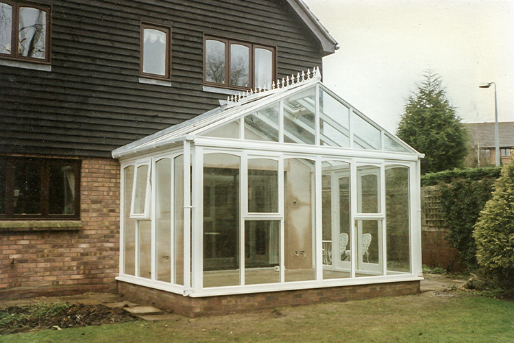 White PVCu Georgian Gable Conservatory with Solar control self cleaning roof & white PVCu French doors