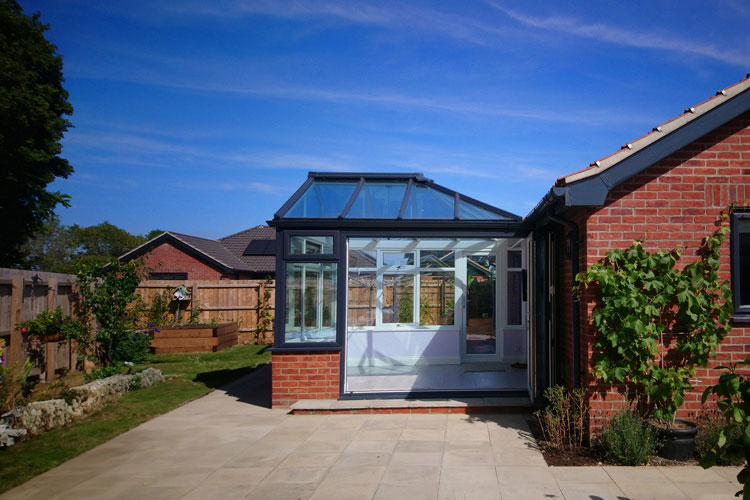 Anthracite on White PVCu Georgian Gable Conservatory with Solar control self cleaning roof & aluminium Bi-Folding doors
