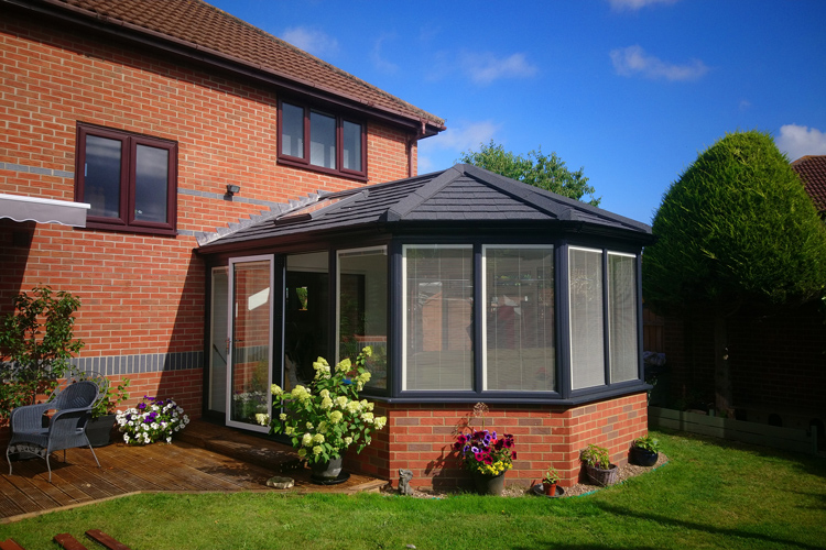 Victorian Style with Metrotile Charcoal tiles, Velux opening roof window. Anthracite Grey/White windows
