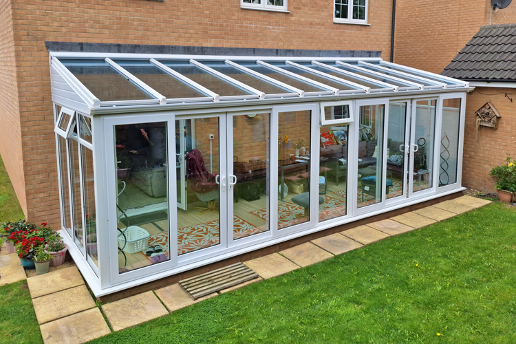 White PVCu Lean- To Conservatory with solar control self cleaning glass Roof, 2 sets of double opening Patio Doors