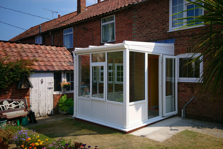White PVCu Lean-To Conervatory with 35mm Heat Guard Polycarbonate roof sheets, single door & 600mm white insulating panels