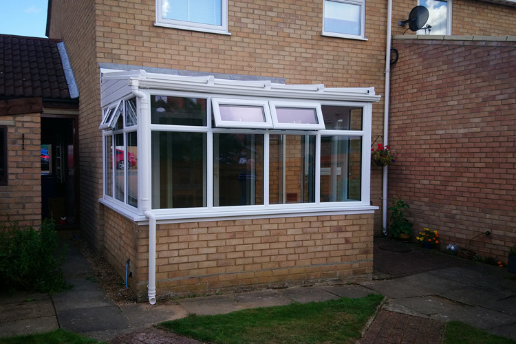 White PVCu Lean - To Conervatory with Hear guard polycarbonate roof sheets