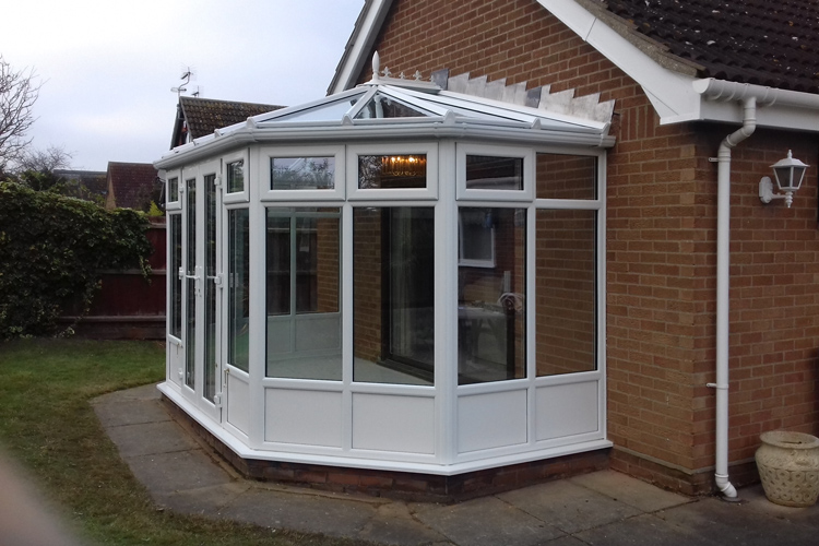 White PVCu Victorian Conservatory, solar control glass roof with white insulating base panels